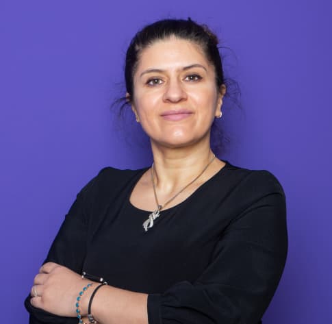 Man standing and smiling - rose background