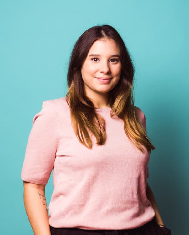 Three guys talking with blue background