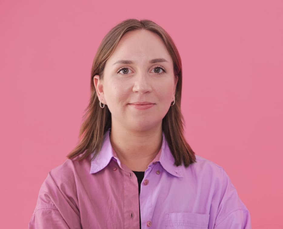 Woman smiling with pink background