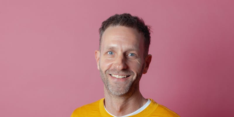man with pink background