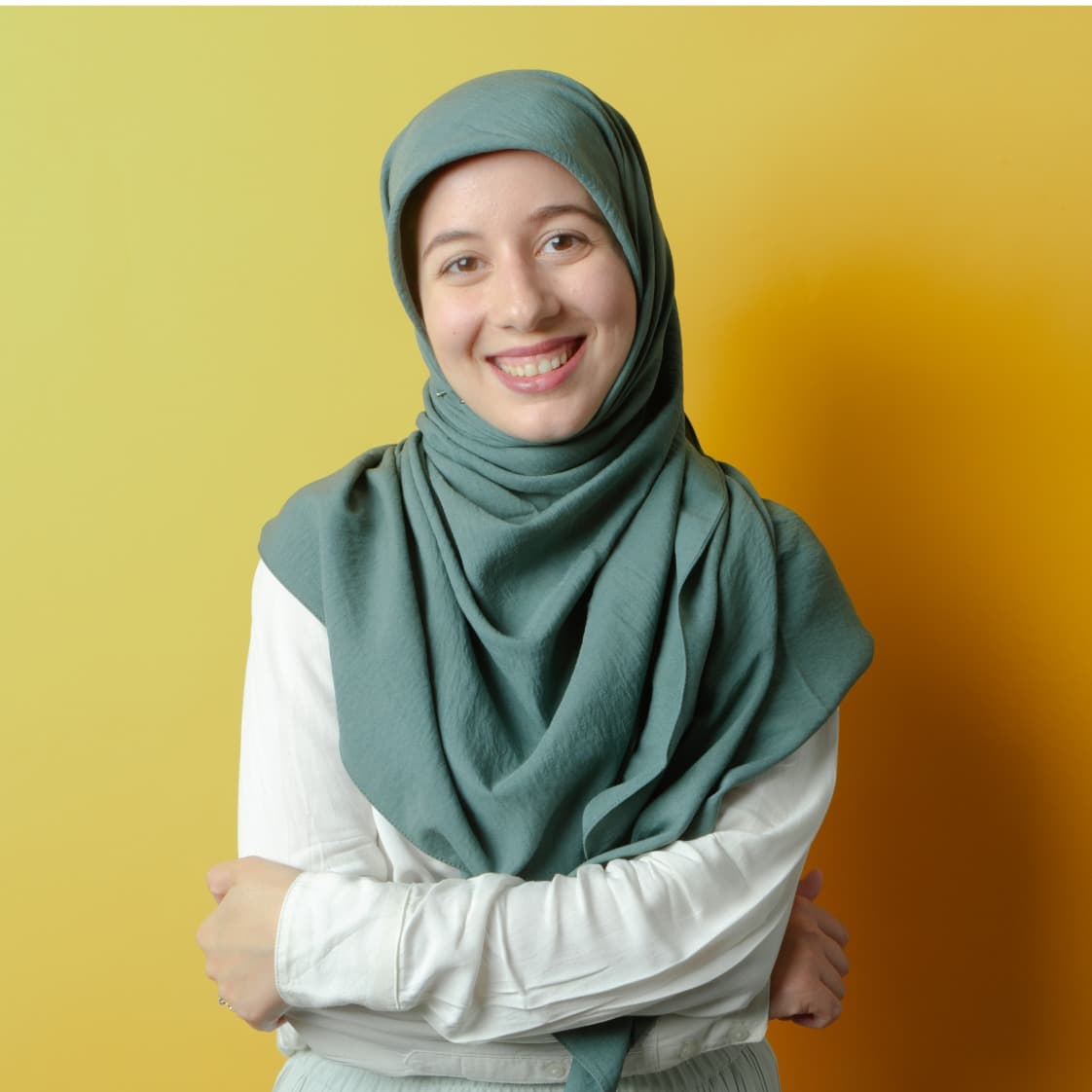 Woman smiling with yellow background