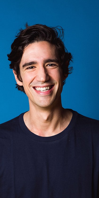 Man smiling - blue background