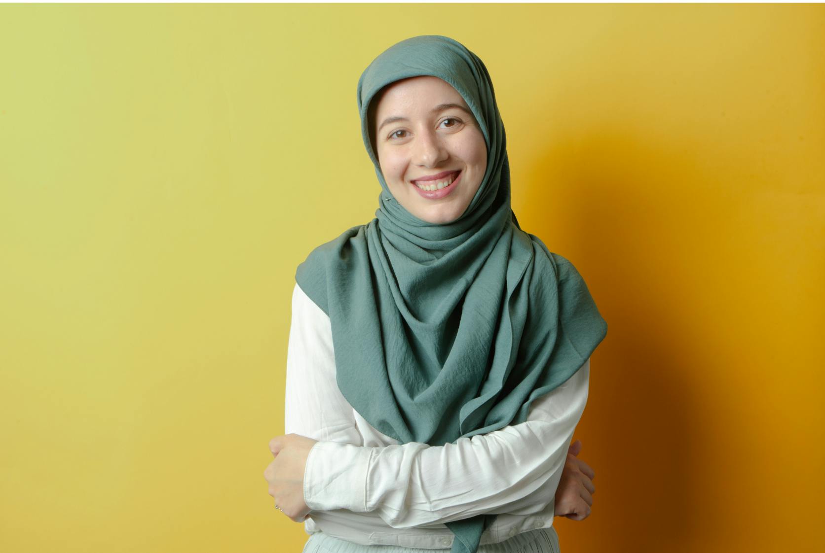 Woman smiling with yellow background
