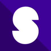 Group of people, sitting, standing, smiling - building in background