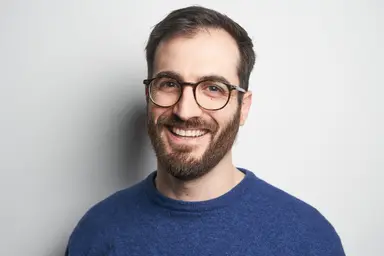 Man standing with blue background