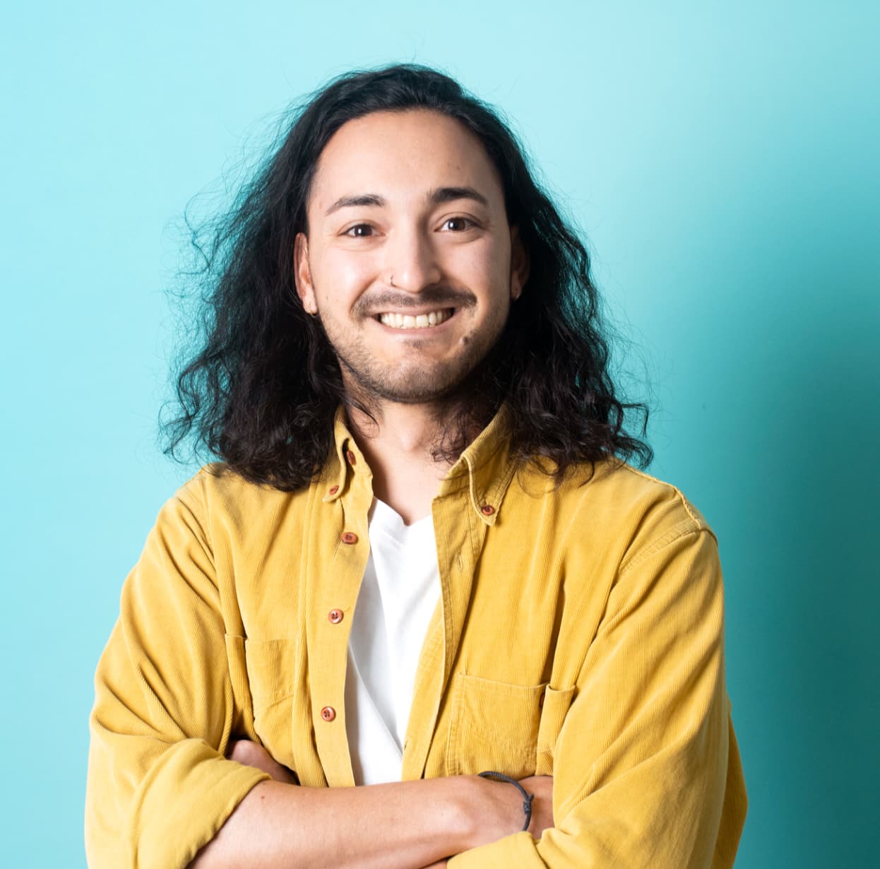 Man standing and smiling - blue background