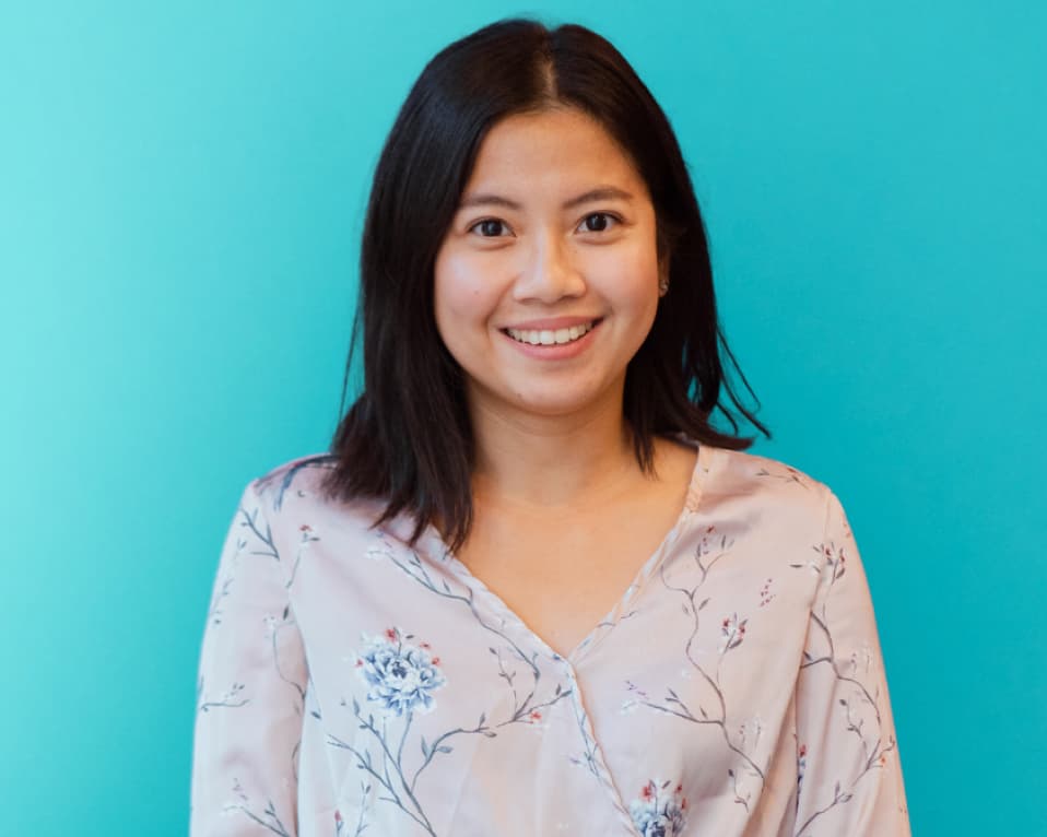 Woman smiling blue background